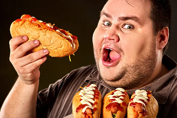 man eating hotdogs | 4th of July Trivia